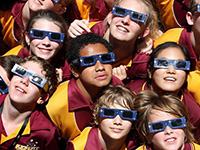 Team wearing eclipse shades