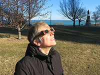 Woman wearing eclipse shades